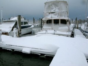 Our neighbor's boat with a cockpit full of snow